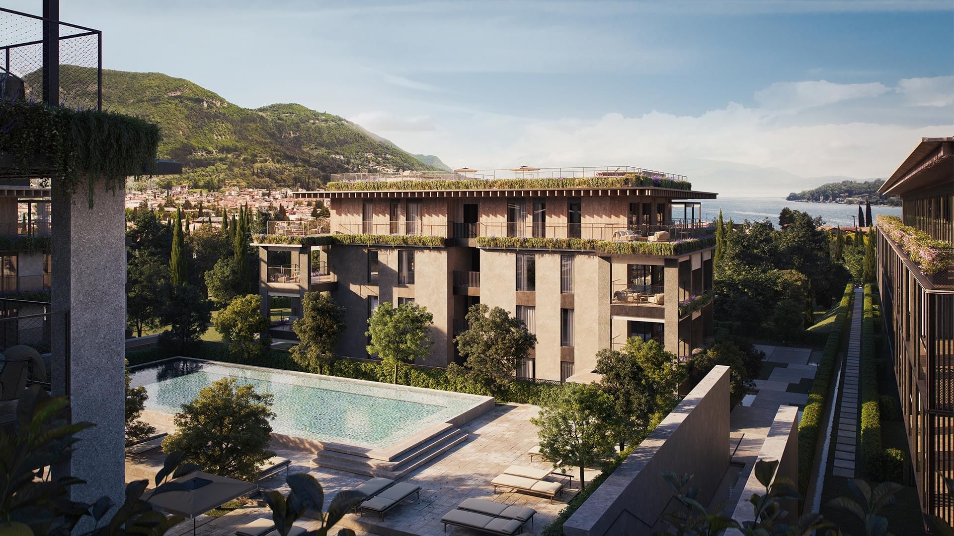 Modernes Gebäude mit begrüntem Dach, Pool und Bergblick, umgeben von Bäumen und Wasser.